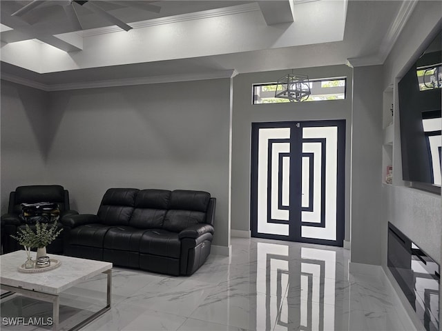 living area with marble finish floor, baseboards, and crown molding