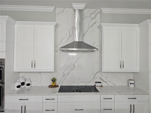 kitchen with white cabinetry, black electric cooktop, and wall chimney range hood