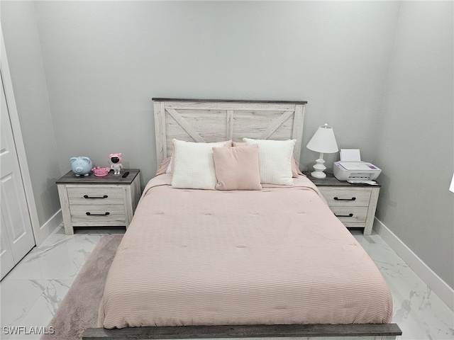 bedroom with marble finish floor and baseboards