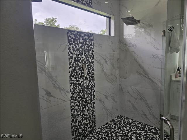 full bathroom featuring a shower stall