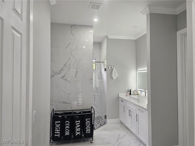 bathroom with ornamental molding, vanity, and tiled shower