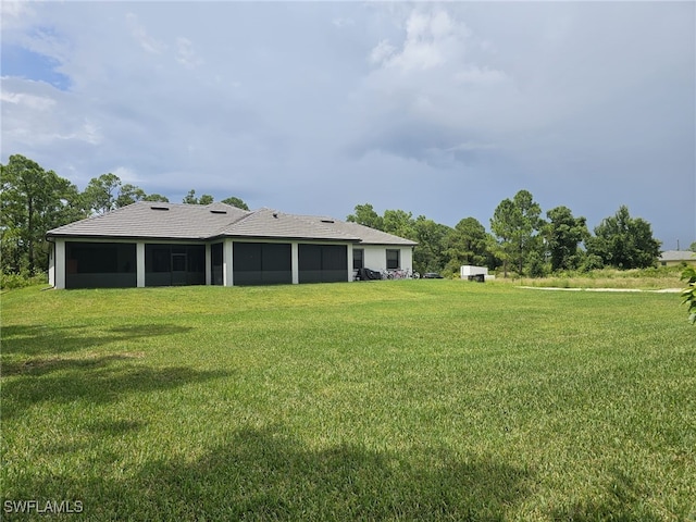 view of yard featuring a sunroom