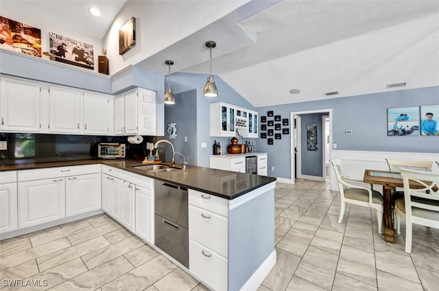 kitchen featuring decorative light fixtures, beverage cooler, kitchen peninsula, sink, and white cabinetry