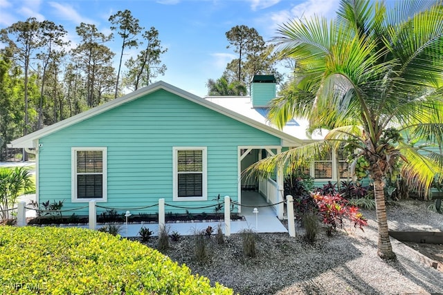 back of house with a patio