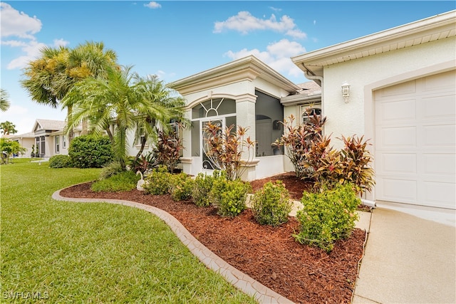 exterior space featuring a front yard and a garage