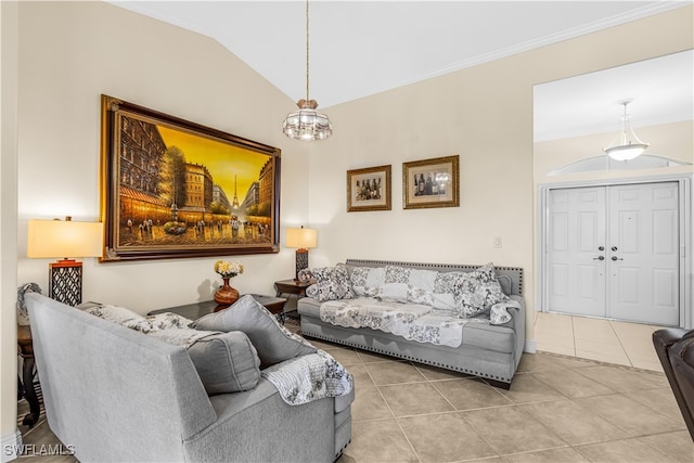 tiled living room with crown molding, lofted ceiling, and a chandelier