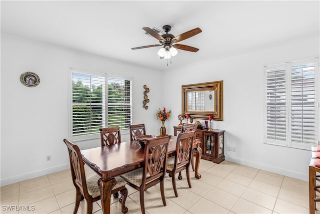 tiled dining room with ceiling fan