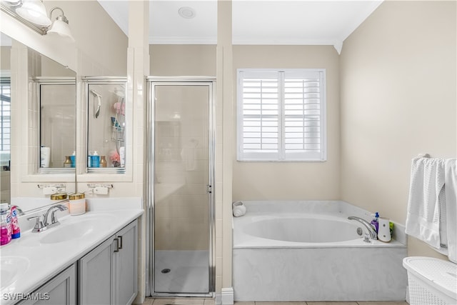 bathroom with vanity, ornamental molding, and independent shower and bath