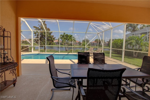 exterior space with a water view, a lanai, and a patio