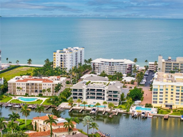 birds eye view of property with a water view