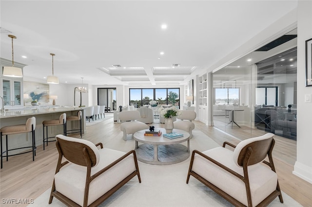 living area with light wood-type flooring, coffered ceiling, beam ceiling, and recessed lighting