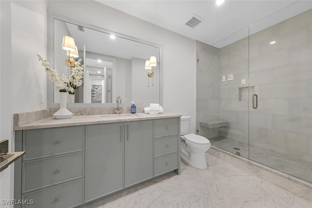 full bath with visible vents, toilet, marble finish floor, vanity, and a shower stall