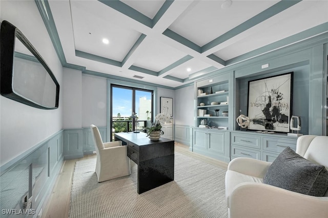 office area featuring built in features, beam ceiling, a decorative wall, light wood-style floors, and coffered ceiling