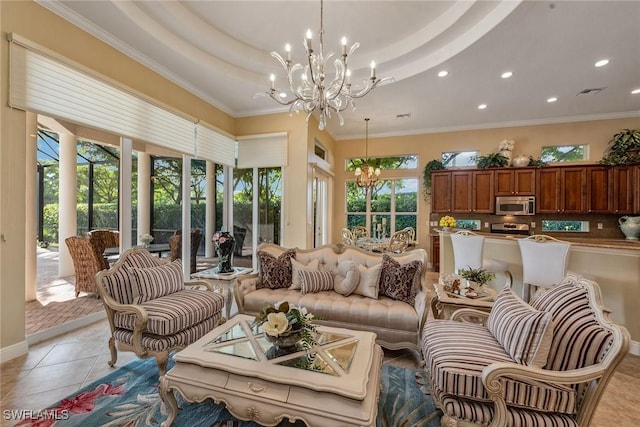 sunroom with a chandelier, plenty of natural light, and a tray ceiling