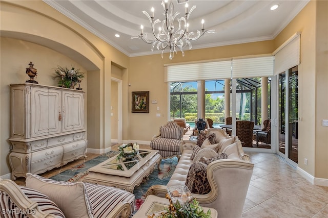 living room with crown molding, a notable chandelier, a raised ceiling, and light tile patterned flooring