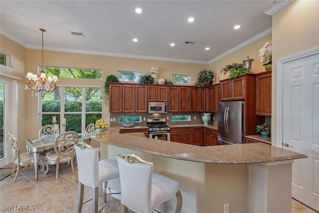 kitchen with tasteful backsplash, visible vents, appliances with stainless steel finishes, and ornamental molding