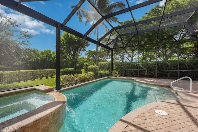 view of swimming pool with a lanai, a patio area, and a pool with connected hot tub