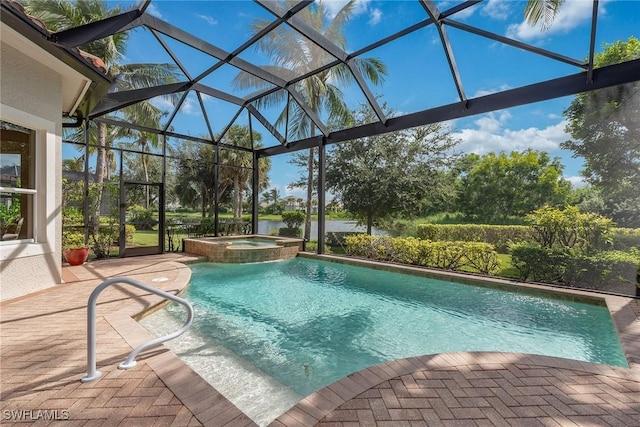 view of swimming pool with a lanai, a pool with connected hot tub, and a patio