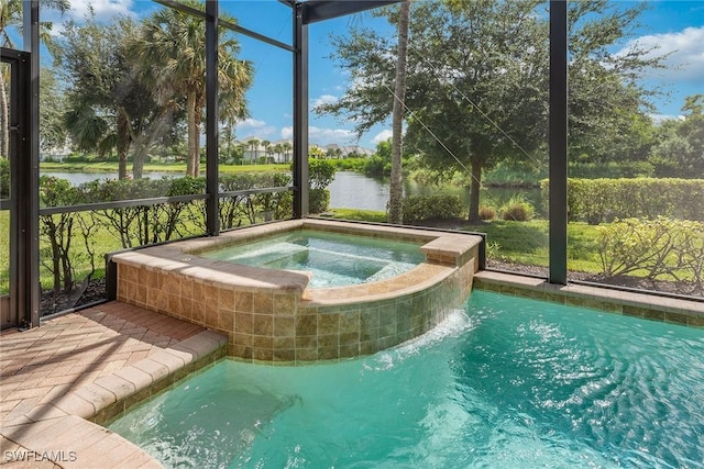 view of swimming pool featuring a lanai, an in ground hot tub, and a water view