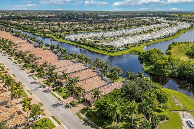 bird's eye view featuring a residential view and a water view