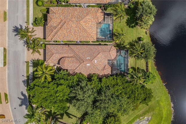 birds eye view of property with a water view