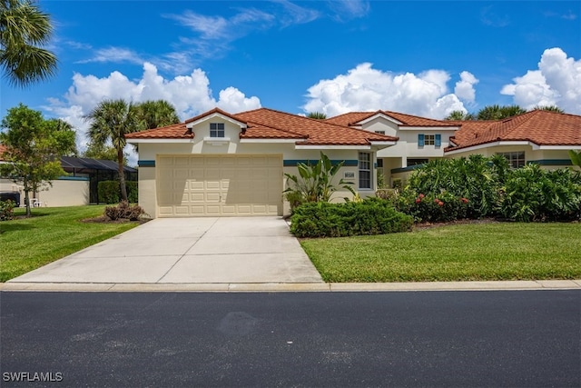 mediterranean / spanish house featuring stucco siding, concrete driveway, a front lawn, a garage, and a tiled roof