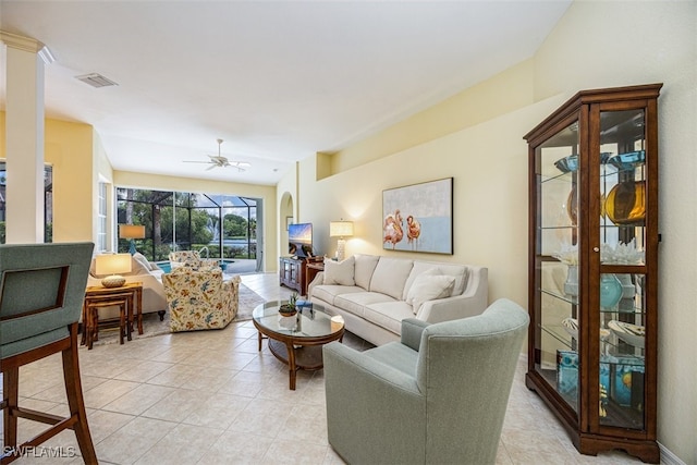 living room with ceiling fan and light tile patterned floors