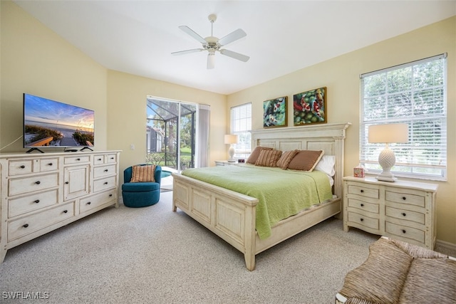 carpeted bedroom featuring ceiling fan and access to outside