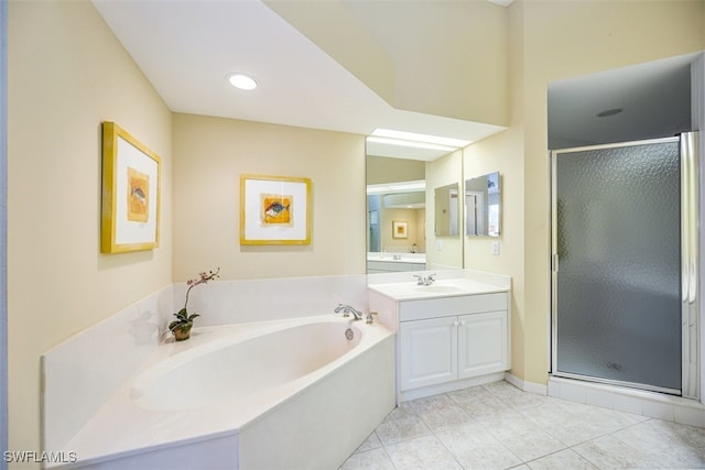 bathroom featuring tile patterned flooring, vanity, and separate shower and tub