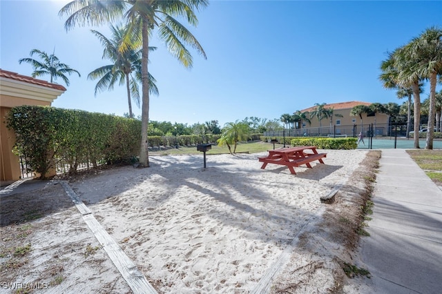 view of yard with tennis court