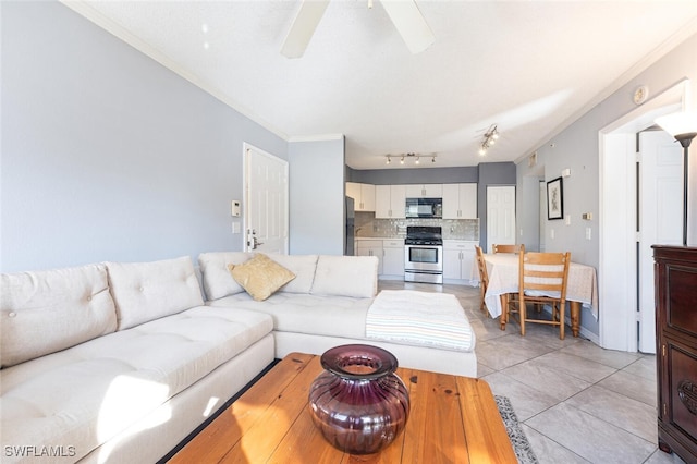 tiled living room featuring ceiling fan and ornamental molding