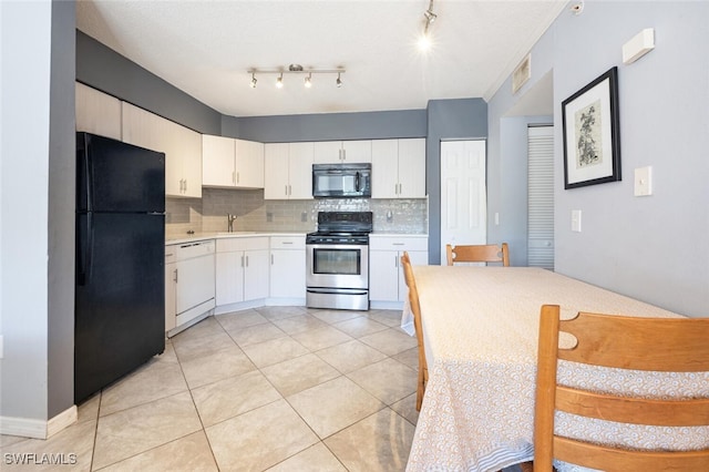 kitchen featuring black appliances, sink, backsplash, and white cabinetry