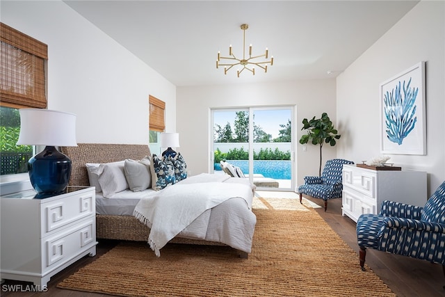 bedroom featuring dark hardwood / wood-style flooring and a notable chandelier