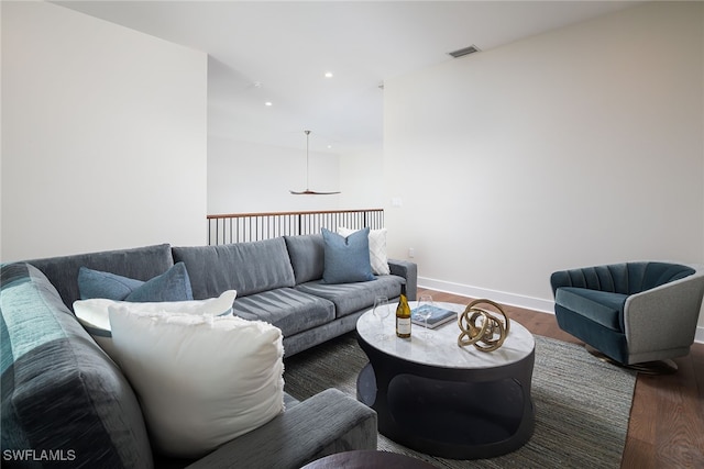 living room featuring dark wood-type flooring