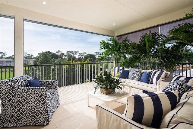 view of patio featuring a balcony and an outdoor hangout area