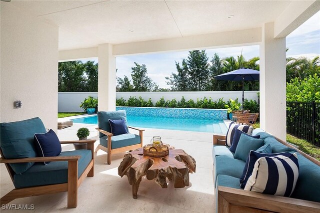 view of swimming pool with outdoor lounge area and a patio area