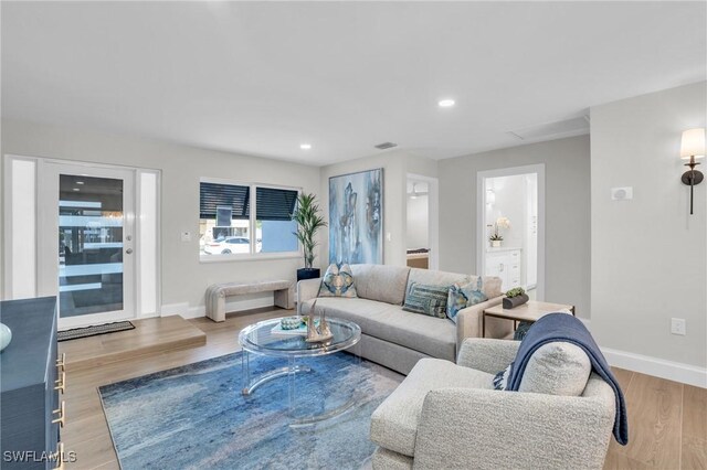 living room with light hardwood / wood-style flooring