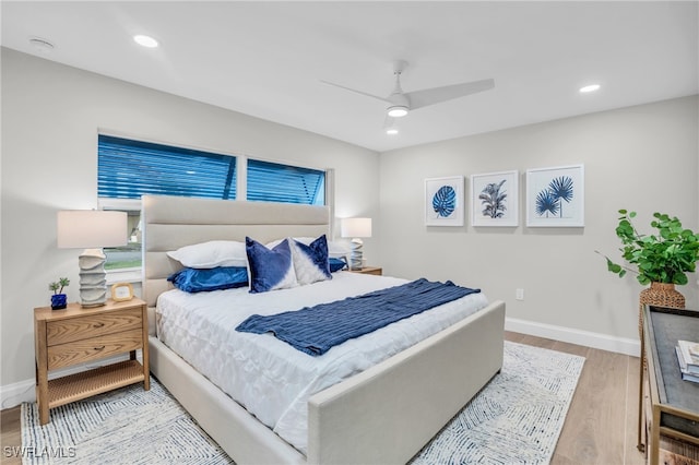 bedroom featuring light hardwood / wood-style flooring and ceiling fan