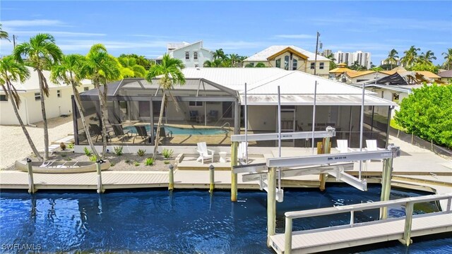 view of dock with a water view and a lanai