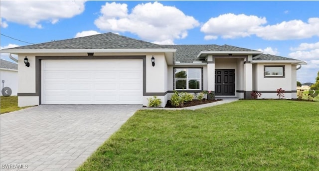 view of front facade featuring a garage and a front lawn