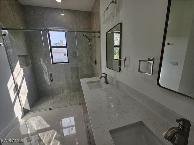 bathroom featuring vanity, tile patterned floors, and walk in shower