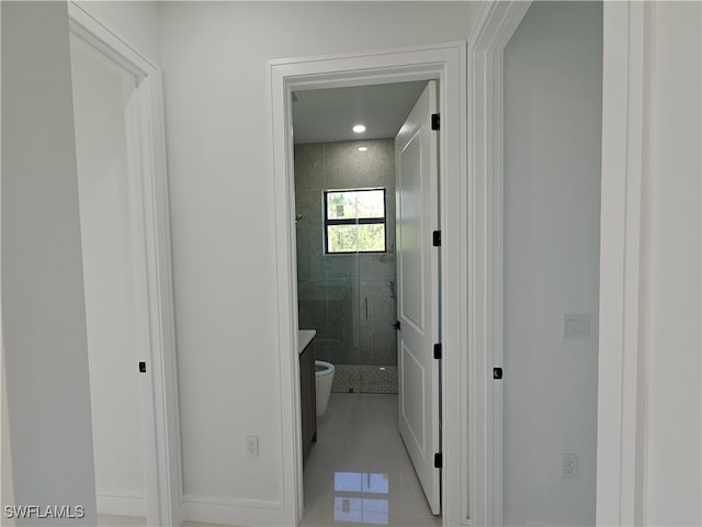 hallway with light tile patterned floors