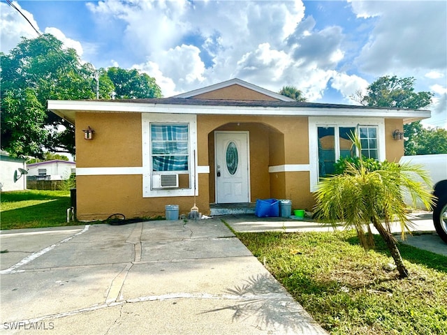 view of front of house featuring cooling unit