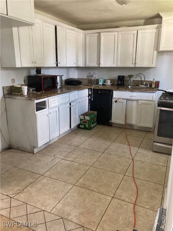 kitchen with white cabinetry, light tile patterned floors, dishwasher, and stainless steel gas range