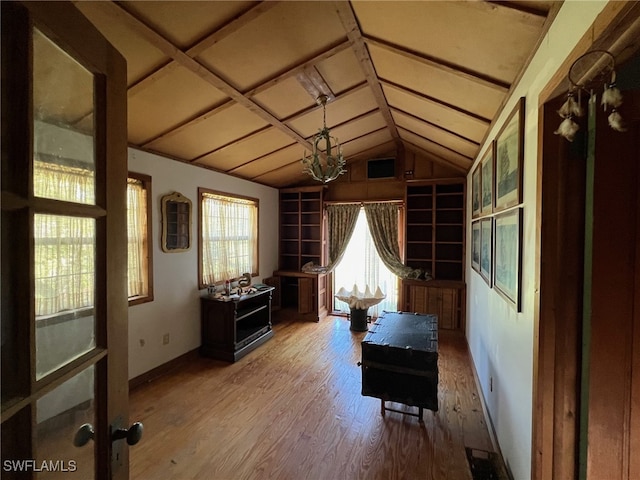 interior space with hardwood / wood-style flooring and a notable chandelier