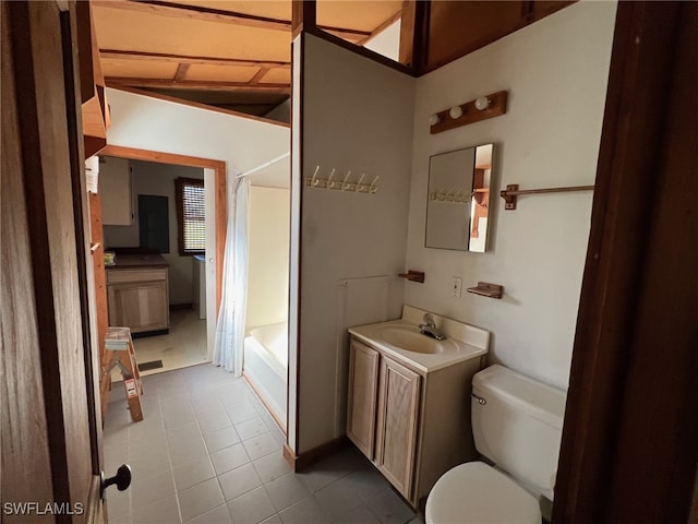 full bathroom with vanity, lofted ceiling, tile patterned flooring, toilet, and shower / bath combo with shower curtain