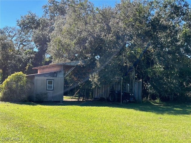 1603 Tom Coker Rd, Labelle, FL 33935 - view of grassy yard featuring an outbuilding