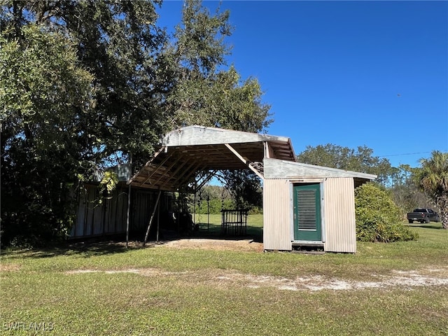 view of yard featuring a carport and a shed