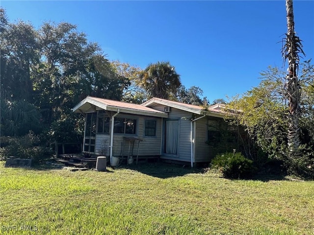 1603 Tom Coker Rd, Labelle, FL 33935 - view of front of property featuring a front lawn and a metal roof
