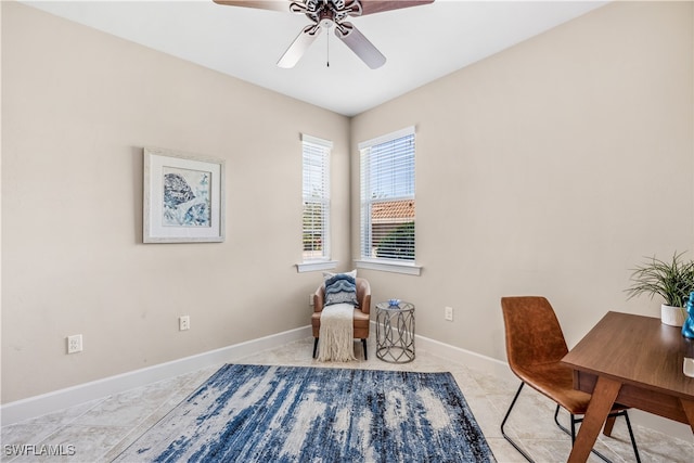 sitting room with ceiling fan